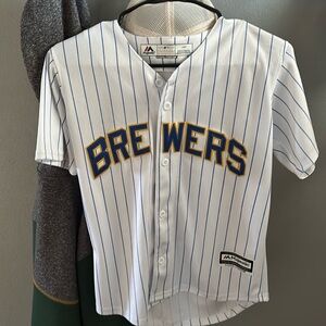 Multiple baseball and football jerseys and one basketball jersey